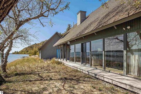 On the north shore of Crystal Lake (Beulah MI) is an architectural gem: a meticulously constructed mid-century modern home (MCM) designed by Robert C. Metcalf. Metcalf homes are known for fastidious attention to detail, integration of interior and ex...