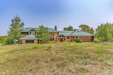 Seller Financing Terms Available! Escape to your own private paradise in this stunning 3491 SF country home nestled among 70 acres of breathtaking natural beauty. Enjoy the tranquility of the aspen, apple trees, fir, and evergreens, with the majestic...