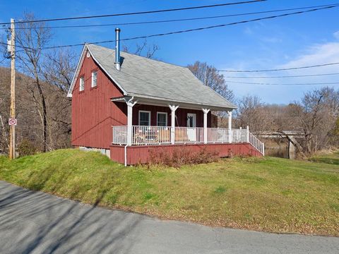 Bordered by the Massawippi River, this charming property offers an intimate 1.4-acre lot and well-placed balconies to enjoy the views and fresh air. Inside, a cozy wood stove adds a warm and inviting touch to the home, which includes two bedrooms ups...