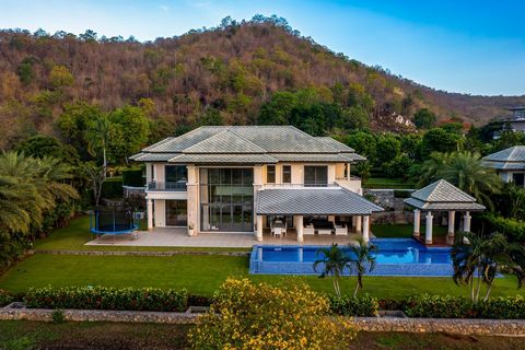 Discover an extraordinary lifestyle at Black Mountain in Hua Hin, Thailand. This prestigious home offers a rare chance to own one of the most sought-after properties in the area. Key Features: Stylish 2-story home with 565 sqm of living space 4 bedro...