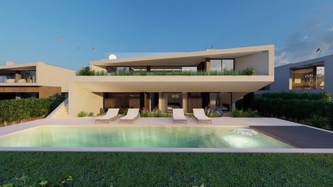 Diese außergewöhnliche Villa mit 4 Schlafzimmern verbindet modernes Design mit einer unschlagbaren Lage, nur 300 Meter vom Camilo-Strand entfernt, mit atemberaubendem Blick auf die Algarve-Küste. Beim Betreten finden Sie zwei geräumige Schlafzimmer m...