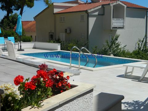 Villa with apartments and swimming pool for sale, located 200 m away from the beach and 7 km away from Omiš. The villa is south facing and spreads over four floors with a total of 8 apartments (seven 1-room apartments, and one studio apartment) with ...