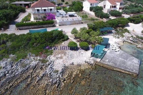 For sale a holiday house in the first row to the sea, situated on the north side of Korčula island in a sheltered cove. House has three floors and offers unforgetable open view of the sea and surroundings. At the ground floor are two apartments wit s...