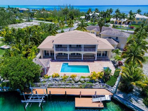 Welcome to paradise on Spanish Main Drive, Grand Bahama Island! Prepare to be captivated by this breathtaking canal front home, an absolute gem boasting 6,500 square feet of luxurious living space with beach access to a picture postcard beach. This e...