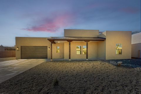 This modern construction home features sleek quartz countertops, polished concrete floors, and top-of-the-line stainless steel appliances. With spacious living areas, a walled backyard for privacy, and a covered patio, it seamlessly blends style with...