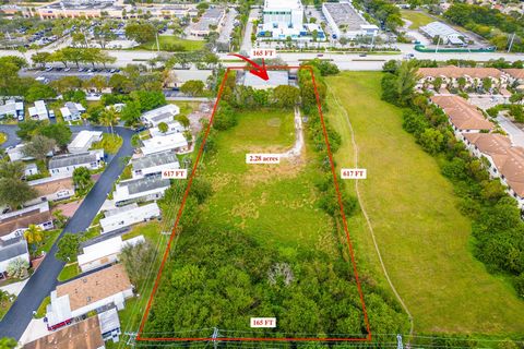 Strategically situated on W. Hillsboro Blvd in Coconut Creek in Broward County, this property offers convenient access to both I-95 and the Turnpike. Spanning +/-2.28 acres of land, it features a +/-5,736 sq. ft. Steel Warehouse structure and a +/-1,...