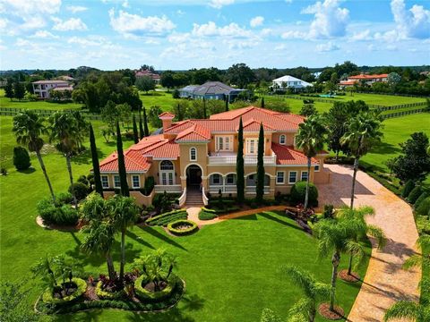 This luxurious 5 bedroom, 6 bathroom estate spans an impressive 6, 606 square feet on almost 2 acres in this private gated and guarded community. Throughout you'll find upgraded options like crown molding, tray ceilings, elegant light fixtures, as we...