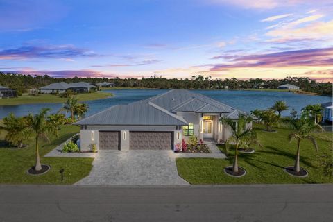 Wake up everyday to a PANORAMIC view of the sunrise and the water! Located on a prime water lot, this HALF ACRE custom home was built to maximize everything good about SWFL living! A sprawling 2,779 sq ft home with THREE masters, DEN and an additiona...