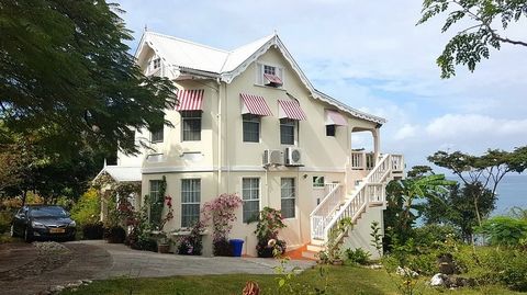 Lovely Victorian home located on the water at Belmont in St. George's. This classic sits surrounded by the lovely blue waters of the Caribbean Sea, with stunning views out to Grand Anse Beach in the South and the Mountain range of the North. On 1 acr...