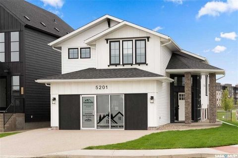 Welcome to 5201 E Green Crescent. This amazing bi-level home is newly built in the Greens on Gardiner neighborhood. Close to lots of amenities, shopping and restaurants. It is situated on a corner, park backing lot, with beautiful views, surrounded b...