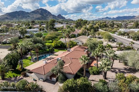 Located in the prestigious Paradise Valley just a short bike ride away from Kiva Elementary school with dominant VIEWS of Camelback Mountain! The 3 bed, 3 bath, 3,345 sqft home sits tucked away with a long driveway adding to the property's privacy an...
