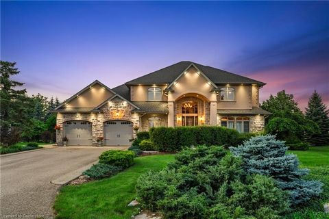 Nestled in an exclusive gated enclave of only twenty homes on the serene shores of Puslinch Lake, this luxurious executive estate offers an unmatched blend of elegance and lifestyle amenities. Designed for both relaxation and entertaining, the proper...