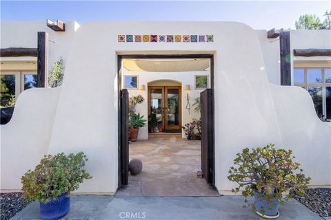 Discover a timeless Southwest ranch retreat set on 2.94 acres of fully usable land, offering the rare blend of privacy, nature, and community. This 3-bedroom, 3-bathroom residence features soaring ceilings and expansive windows that frame peaceful fo...