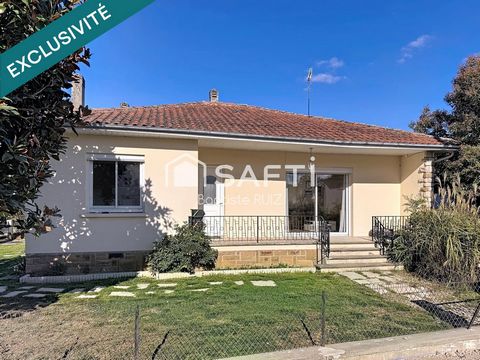 Maison familiale de 98 m² avec jardin arboré.