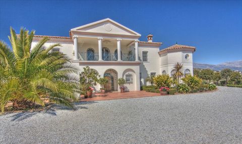 Impressive country residence in Spanish Colonial Style with stunning views of Lake Viñuela and the mountains. Bespoke design by current owner. Style and quality throughout with no expense spared on either the construction or interior decoration. Over...