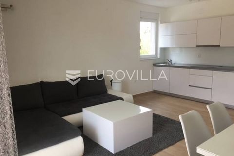 Pag, center of Novalja, modern furnished three-room apartment in a new building in a quiet side street, approx. 250m from the sea and a few minutes from the old town. Floor plan description of the apartment: Ground floor - entrance area, living room ...