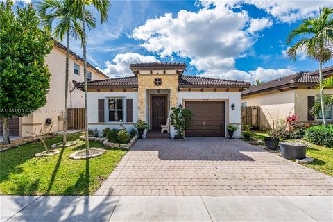 Stunning Home in Atlantis at Oasis, a private gated community w/ clubhouse, pool, gym, playgrounds for the kids, & more! The home is a 4/2 split plan that features a large Main Suite & Bath w/ walk in closet, Bullnose granite counter tops in the Kitc...