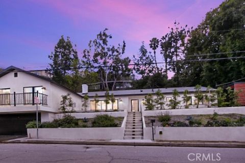 Welcome to Sherman Oaks and the beautiful rolling hills with vast views of mountains and city lights. Coy Drive is well known for its close proximity to the city but nestled in a quaint neighborhood. The home has been renovated throughout from high e...