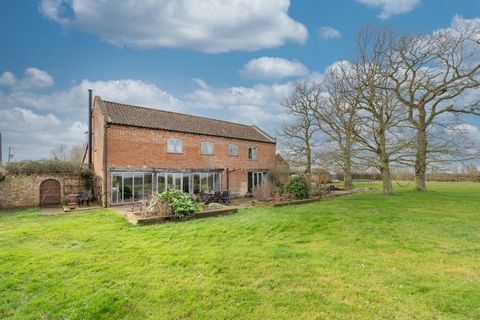 Sitting in just under two acres, down a long private drive shared with only two other homes, this spectacular barn conversion is surrounded by open fields with a wonderful sense of space and connection to the countryside. The lifestyle here is an env...
