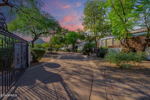 Welcome to Paradise! Spanish Estate, with a dramatic setting of the Mummy Mountains, truly shows pride of ownership! This beauty sits on a large corner lot, showcasing a beautiful backyard oasis with two gazebos, a circular driveway, fountains, a pav...