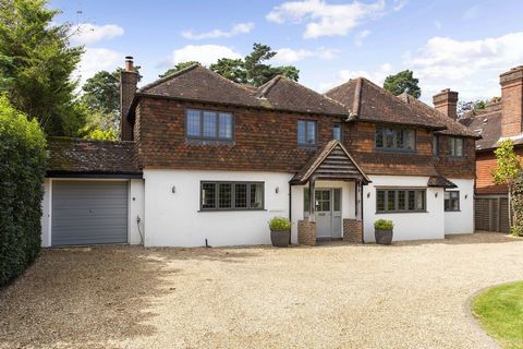 Fine and Country are proud to present this exquisite five-bedroom, three-bathroom home situated on a generous plot in the tranquil surroundings of Haslemere. Perfect for families and entertainers alike, this property boasts four reception rooms, a sw...