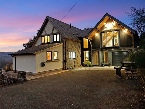 An impressive family home with what can only be described as 'one of the best views in Wales'. This 2500 sq ft family home has been enhanced with a stunning oak-framed extension creating valuable additioanl space with an impressive master bedroom fea...