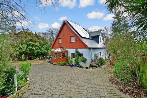 Approached via a large block paved driveway this attractive four-bedroom, part cedar clad chalet bungalow is set far back from the road and almost hidden from sight. It provides a tranquil ambience with impressive views across to the sea and, designe...