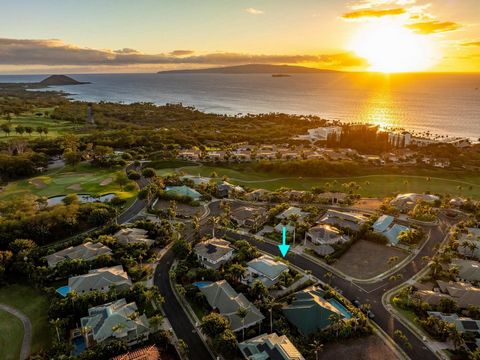 Enter this elegant Wailea Golf Vistas home through the bespoke etched glass door in to a 2 story atrium featuring a baby grand piano and a dramatic spiral staircase. The custom designed and built home includes high ceilings, a heated pool and spa and...