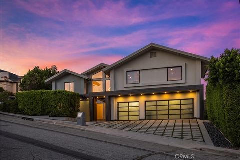 Poised along Glendale's most coveted address, Rimcrest Drive, this contemporary estate unfolds across more than 6,000 square feet of inspired design, marrying architectural artistry with resort-style amenities. Spanning three impeccably crafted level...