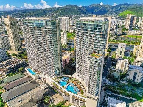 Indulge in luxurious island living with this exquisite 2 bedroom, 2 bathroom corner unit located in the award-winning Ritz-Carlton Residences of Waikiki. Boasting panoramic views of the ocean, sunset, and Waikiki, this condo is a true paradise. Insid...