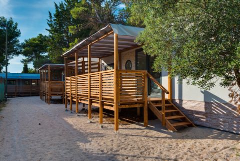 Located in Vodice, 10 km from Šibenik, a recognized nautical and tourist center in the heart of the Adriatic coast. For the elderly and families with children, there is a quiet part of the beach where you will find a children's train, trampolines, bo...