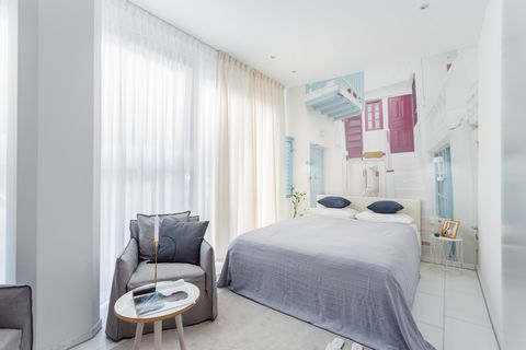 This bright and spacious studio features classic marble floors, harmonious color palette and exclusive designer furniture. The cozy living area with a custom-made sofa and flat screen TV constitutes a perfect space to relax. In the bedroom area guest...