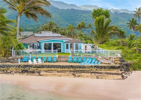 Paradise found! Enjoy exquisite privacy and luxury in this corner beachfront spacious single-story villa with a lush grassy beachfront backyard and one-of-a-kind grandfathered sea-walled beach in a prime location where a turquoise ocean, forest, cove...