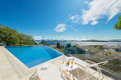 Hvar, luxurious, modern villa with open sea view. It extends over two floors with 195 m2 of living space. It consists of an open-concept kitchen, dining room and living room with access to the terrace through large sliding walls. It also has four bed...
