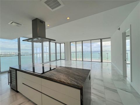 New Building!! This spectacular corner unit offers 3 bedrooms + Den and 4.5 bathrooms. Enjoy spectacular unobstructed water views and a breathtaking city skyline. The 10 ft. floor to ceiling windows create a bright and spacious living area. Large bal...
