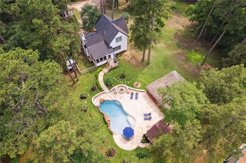 This extraordinary 19+ acre estate offers a unique investment opportunity, featuring a 2024 home, two fully furnished guest-house cabinets, private ponds, hot tubs, a pool with a custom cabana and scenic trails. With only 5 acres developed, the remai...