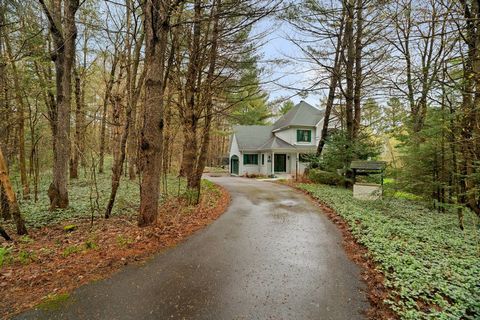 Charming farmhouse property with cathedral ceiling, solid wood floors, wood kitchen, attractive master bedroom with fireplace, en suite bathroom with whirlpool tub and access to balcony overlooking the water. The garden-level basement includes a fami...