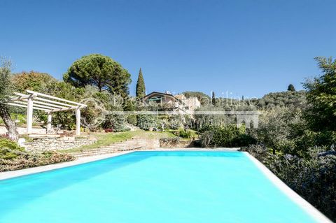 Located in Massarosa. Nestling on the first hillsides of Versilia, in the municipality of Massarosa, this prestigious property is set in its own grounds of approximately 4500 sqm. The land, which is completely fenced off, consists of a well-kept gard...