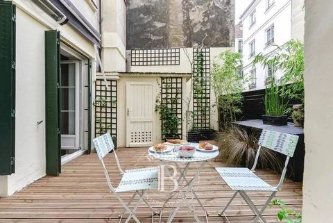 In a building dating from the early 19th century, on the 1st floor with stair access, this charming apartment offers a surface area of 46.34m² (499 sq ft) under the Carrez Law with exclusive use of a 20m² (215 sq ft) terrace! Prime location 100m (110...