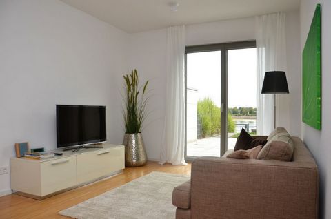The modern barrier-free 2-room garden apartment offers you 65 sqm of living space and a 40 sqm terrace directly above the Rhine with in-house access to the Rhine promenade. The furnishing and equipment is modern and of high quality. The living room a...