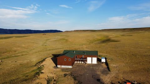 WHAT A DEAL! This newly built home is a spacious 5,200 finished square feet of comfortable living space complimented by a heated garage and shop that offer ample space for parking, working, and playing. Located west of Laramie, WY, in Wild Horse Ranc...