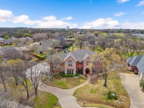 A Texas-sized home with 5 BR's, 6 baths situated on a treed 1.02-acre lot a short 10 miles to DFW airport Flower Mound. 2010 full remodel added sq. ft. and many updates. 2-story home has an open floor plan, hand-scraped wood floors, oversized 3-car g...