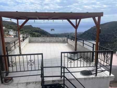 Agios Stefanos, Makry Gialos, South East Crete: A two storey house with stunning sea views. The property is 65m2 on a plot of approximately 40m2. On the first floor there is an open living - kitchen area with fire place and a balcony enjoying sea vie...