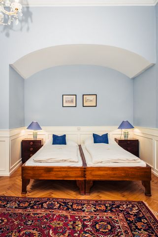 The apartment is on the 1st floor of a well-kept baroque house in a quiet side street in the city center. The apartment has partial underfloor heating, stylish furniture, marble, tile and parquet floors. Furnishing: living room/bedroom 2 beds each 90...