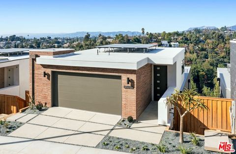 Live the LA dream in spectacular style. On a tranquil Echo Park cul-de-sac this newly-built modern presents expansive light-filled interior volume and boundless westward views. Living, dining and an atrium-style patio connect to the designer kitchen ...