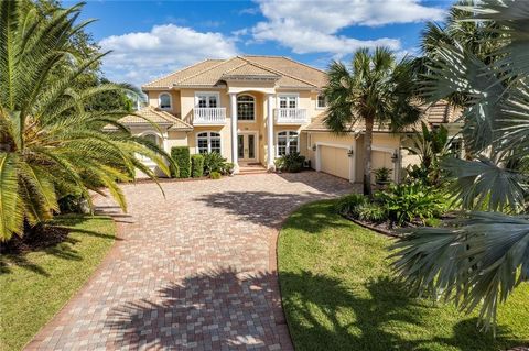 Welcome to your own private oasis in Palm Coast, Florida. This luxurious riverfront estate home is located on a gated island community, offering the utmost privacy and tranquility. Situated on a meticulously manicured 1.74-acre lot, this custom-built...