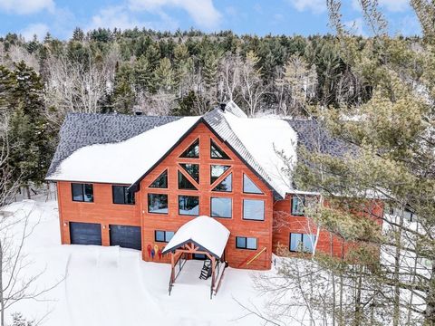 On an enchanting site in Gore with wooded land, this prestigious property with heated double garage built with top quality materials in a rustic chic style will please you (see 3D virtual tour). It offers a spacious bright open area, high ceilings, a...