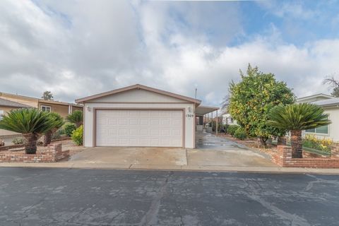 Wow!! Don't let this wonderful golf course view home pass you by! As you approach you'll notice how well maintained the beautiful landscaping is. There is a cozy enclosed patio and separate covered patio overlooking the golf course. Passing through t...