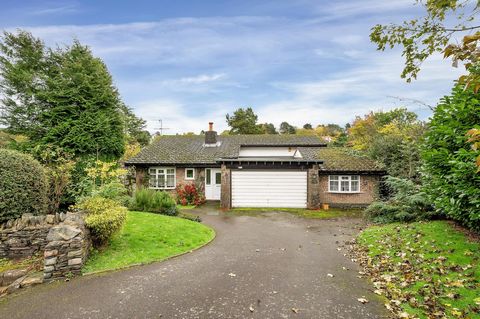 Individually built in the early 1970’s, this surprisingly spacious, split-level home with established South East facing garden enjoys elevated views across the village. Located at the very end of Bird Hill, this unique property shares three of its bo...