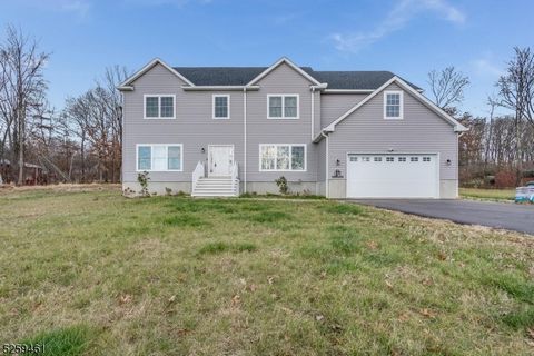 Wow! This 5 BR, 4 BA custom colonial built in 2021 has all of the New Home features you're looking for and more! The open concept plan features an AMAZING CHEF'S KITCHEN open to a dramatic 2 STORY GREAT ROOM! Just off the spacious entry foyer is an e...